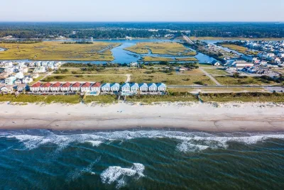 Aerial view of the beachfront houses and marsh at Ocean Isle Beach